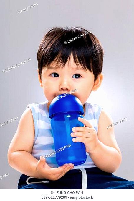Baby boy drink with bottle