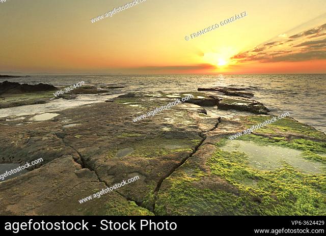Sunrise at Cabo Cervera in Torrevieja, Alicante province in Spain. Horizontal shot with space for text