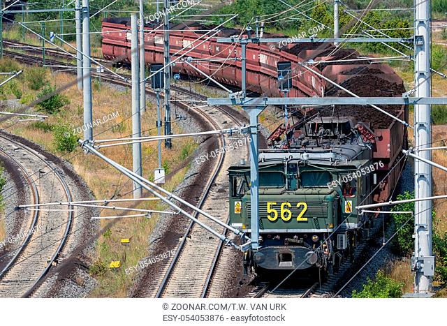 Hambach lignite mine, Germany - June 28 2018: German train transporting brown coals from Hambach open pit mine to power plant