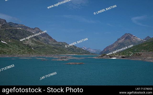 Landscape at the Lago Bianco reservoir at the Bernina Pass in the sun