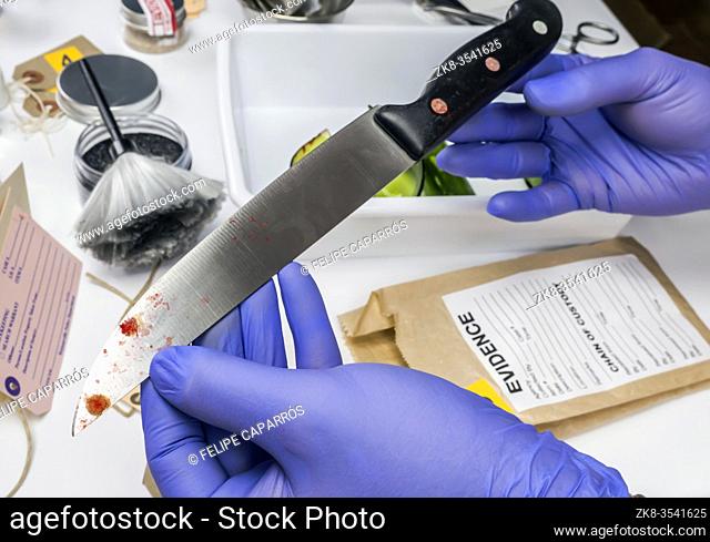 Scientist takes samples of a knife in laboratory, conceptual image