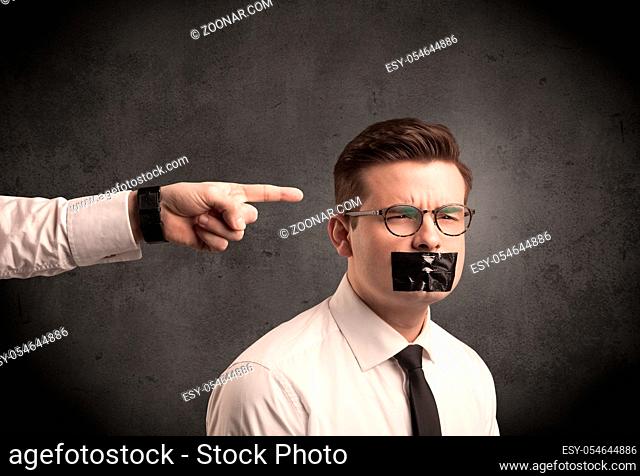 Caucasian business hand pointing at subordinate male employe