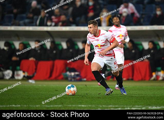 02 March 2022, Lower Saxony, Hanover: Soccer: DFB Cup, quarterfinals: Hannover 96 - RB Leipzig at the HDI Arena. Leipzig's Willi Orbán plays the ball