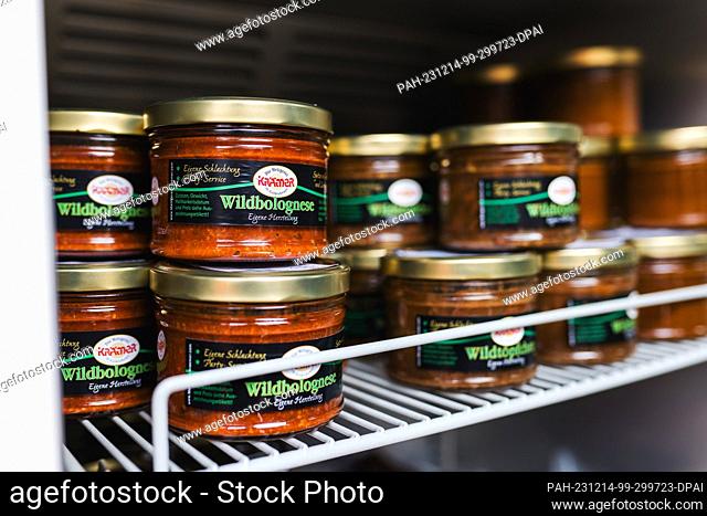PRODUCTION - 29 November 2023, Baden-Württemberg, Offenburg: Jars of ""game bolognese"" stand in a fridge at the Offenburg forestry administration