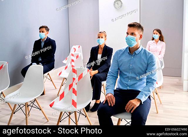 Diverse Job Applicants Waiting For Interview In Face Masks