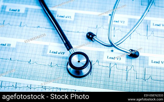 Stethoscope on cardiogram concept for heart care on the desk