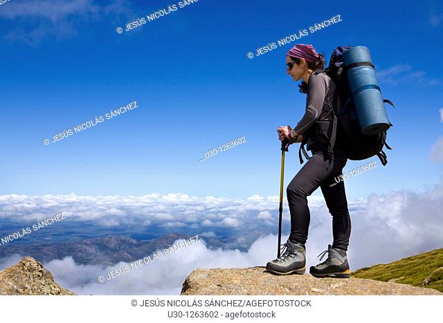 Woman practicing mountaineering in the Sierra de Béjar Natural Park, in Salamanca province, Biosphere Reserve of Sierra de Béjar and Francia