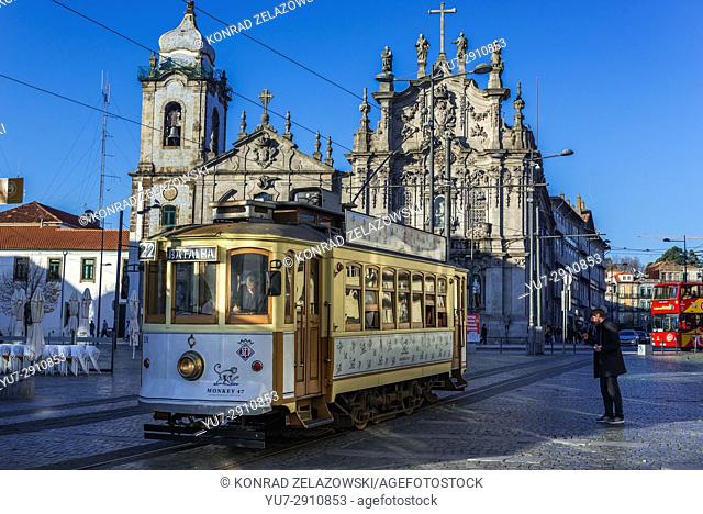Vintage tram in front of Carmelite Church (Igreja dos Carmelitas Descalcos) and Carmo Church (Igreja do Carmo) in Vitoria parish of Porto, Portugal
