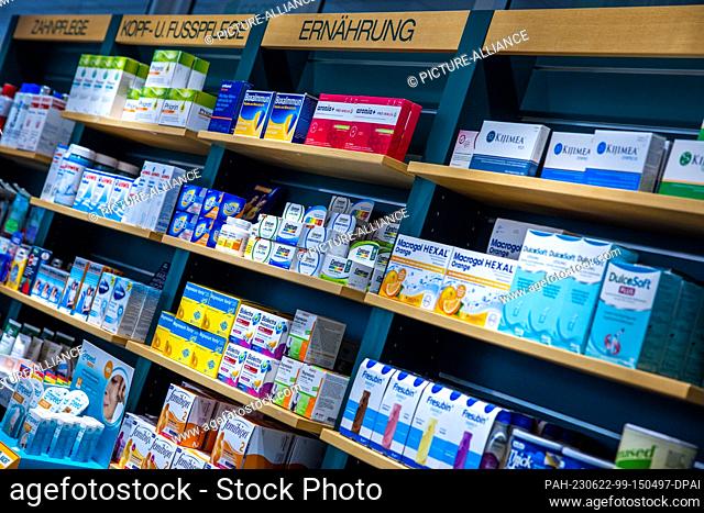 PRODUCTION - 30 May 2023, Mecklenburg-Western Pomerania, Schwerin: Dietary supplements stand on a sales shelf in the Rainbow Pharmacy