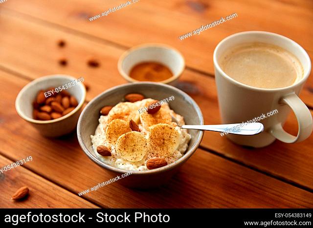 oatmeal with banana and almond on wooden table