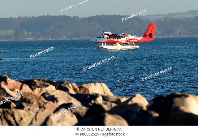 A Twin Otter seaplane on its landing approach in Aarhus,  Denmark, 24 November 2016. The aircraft can accommodate up to 18 passengers and shuttles between...