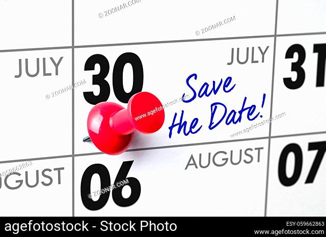 Wall calendar with a red pin - July 30