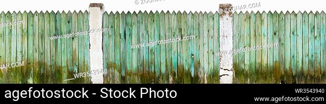 Wet long green aged wooden dirty fence near a rural pigsty. Isolated on white panoramic collage