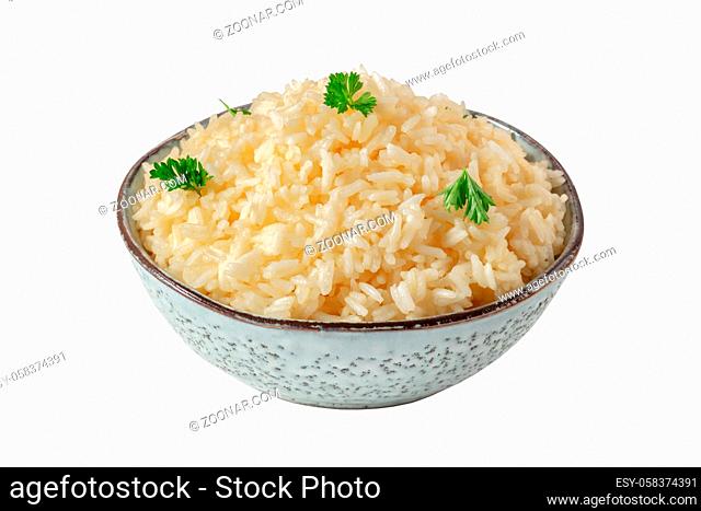 Rice, isolated on a white background with a clipping path. Minimal dish, cooked, served with fresh parsley leaves