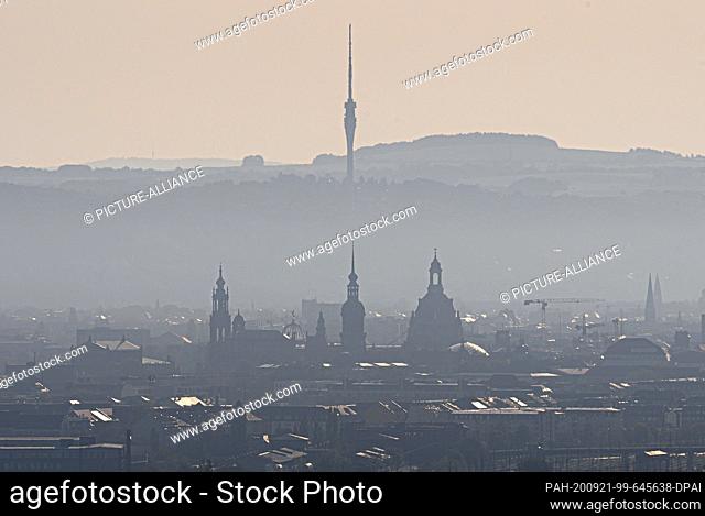 21 September 2020, Saxony, Dresden: View in the morning over the old town with the Semper Opera (l-r), Hofkirche, Ständehaus, the dome of the Academy of Arts
