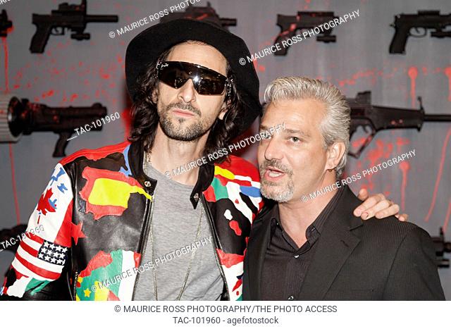 Adrien Brody poses with Daniel Sheps (r), December 2, 2015 at the Art Basel Domingo Zapata Exibition at the LuLu Laboratorium in Miami, Florida