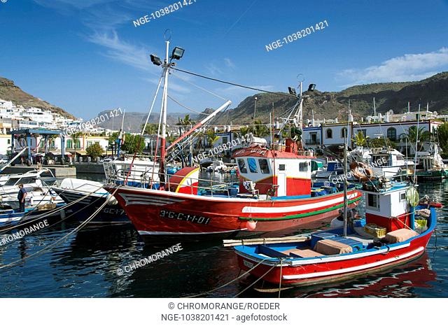 colorful fishing boats in the harbor of Puerto de Mogan