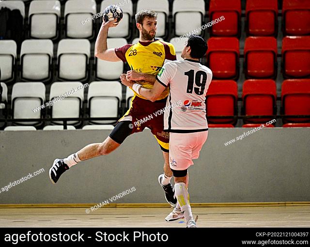 Marek Hlinka of Dukla, left, and Gabriel Martinez Robertsson of Vestmannaeyjar in action during the men's Handball European Cup 3th round opening game IBV...