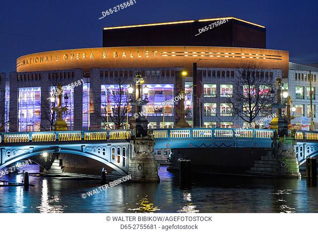 Netherlands, Amsterdam, Amsterdam Music Theater on the Amstel River, dusk