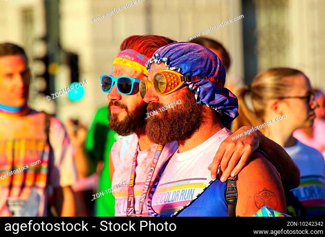 Portrait of men taking part in The Color Run in Trieste, Italy. Trieste is the capital of the autonomous region Friuli-Venezia Giulia
