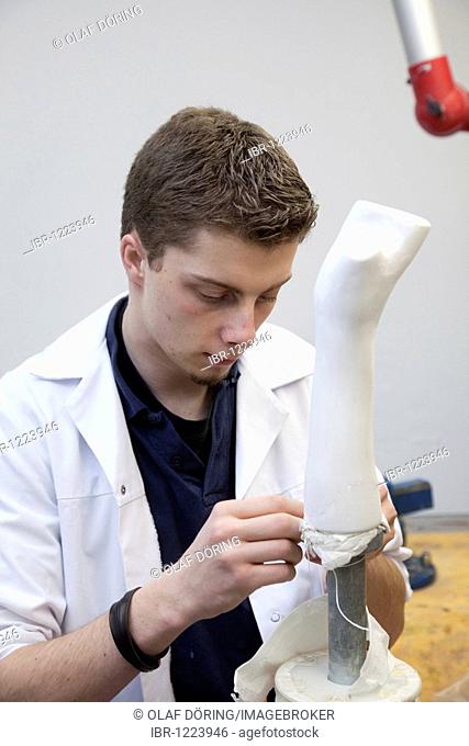 Trainee, orthopaedic technician, making a hand prosthesis