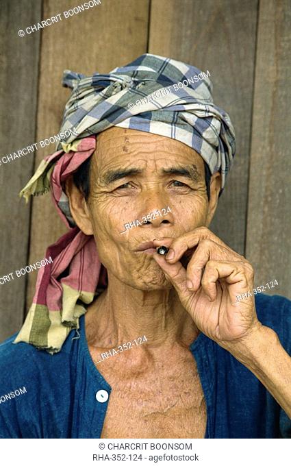 Portrait of refugee smoking, Shan Man Refugee Camp, Tak Maesot, Thailand, Southeast Asia, Asia