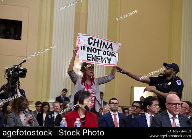 A protestor is removed from the room as Lieutenant General H.R. McMaster (Ret.), Senior Fellow, Hoover Institution, on behalf of Stanford University