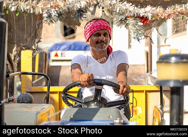 Indian Farmer driving a tractor