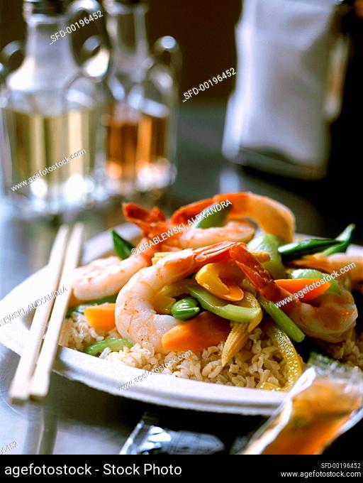 Asian pan-cooked shrimp and vegetable dish on rice