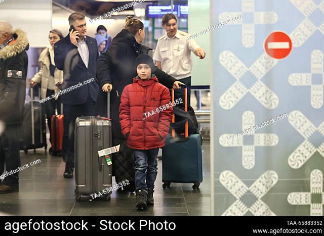 RUSSIA, MOSCOW - DECEMBER 19, 2023: Nikita Artemichev (C) who has arrived on an Istanbul-Moscow flight, is seen at Vnukovo International Airport