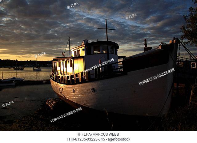 Boats in harbour at sunset, Bembridge Harbour, Bembridge, Isle of Wight, England, june