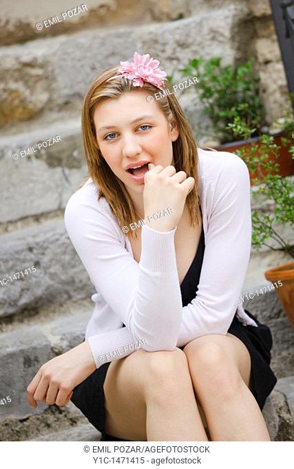 Attractive young woman spontaneous with open mouth