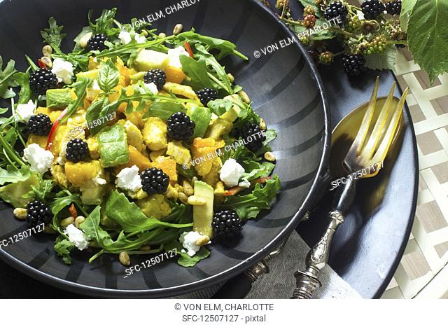 Pumpkin and avocado salad with blackberries and cream cheese