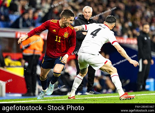 Ferran Torres (Spain) duels for the ball against Hysaj (Albania) during football match between Spain and Albania, at Cornella-El Prat Stadium on March 26