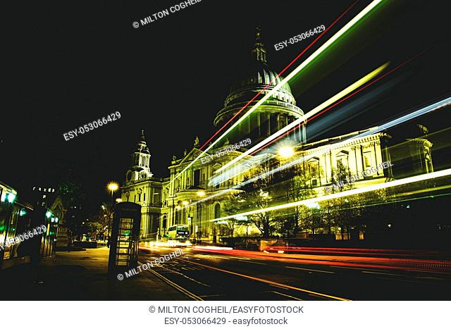 Night view of traffic light trails passing in front of St Paul's Cathedral, London, England