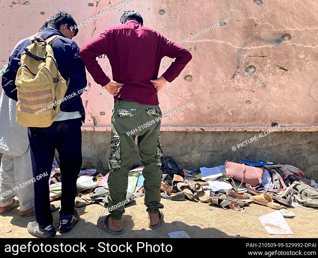 09 May 2021, Afghanistan, Kabul: Several hundred people gathered at the scene on Sunday after the attack that claimed more than 50 lives in the Afghan capital...