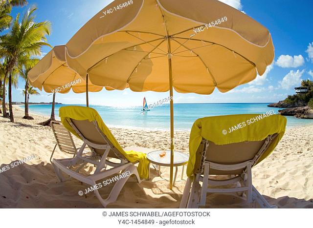 Beach chairs and umbellas on Meads Bay Beach on the caribbean island of Anguilla in the British West Indies
