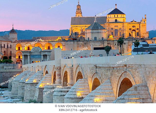 Cathedral (Mezquita) and Roman bridge at sunset, Guadalquivir river, Cordoba, Andalusia, Spain