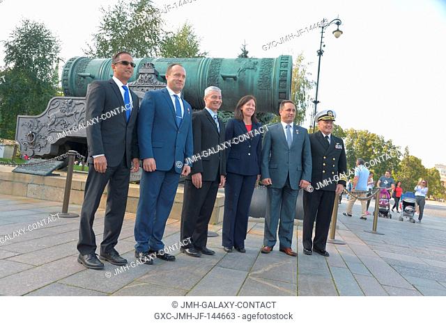 The Expedition 53-54 prime and backup crewmembers pose for pictures in front of the Tsar Cannon at the Kremlin in Moscow Sept