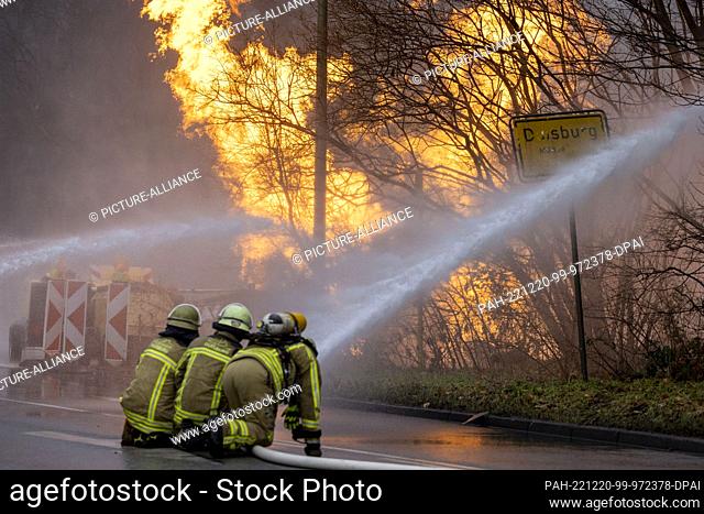 dpatop - 20 December 2022, North Rhine-Westphalia, Duisburg: Firefighters work to extinguish a burning gas leak. The gas line had been damaged during...