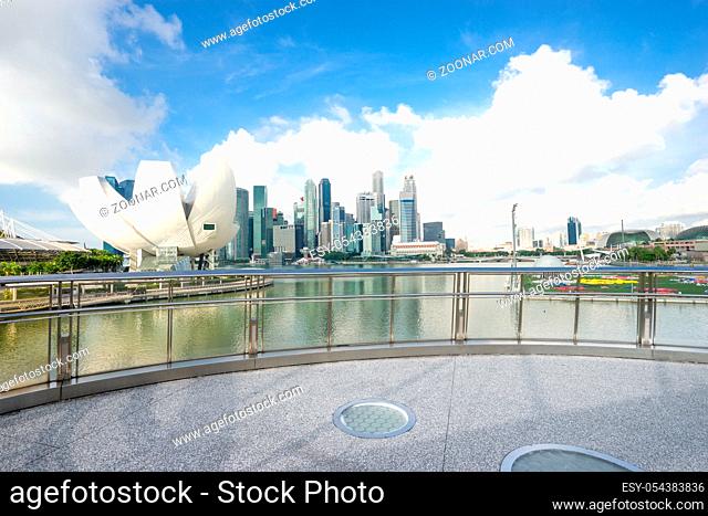 modern buildings near marina bay in singapore in cloud sky from empty floor