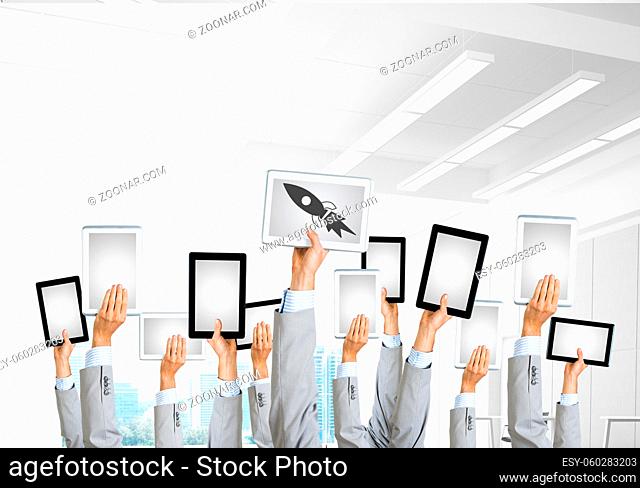 Set of tablets in male hands in modern office interior. 3d rendering