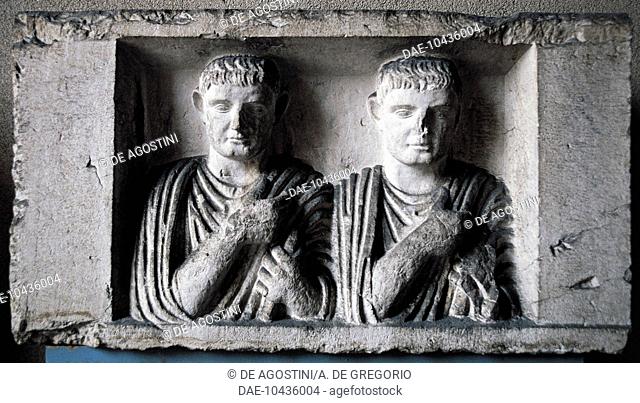 Roman Empire relief depicting two men in tunics, Brescia, Lombardy, Italy.  Brescia, Museo Civico Dell'Età Romana E Tempio Capitolino (Archaeological Museum)
