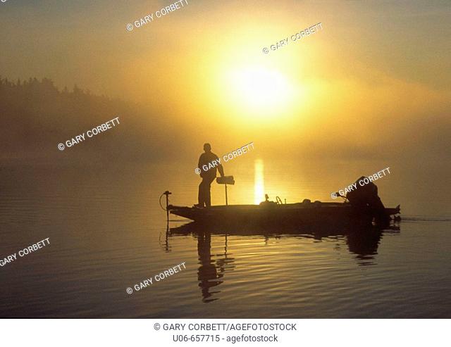 bass fisherman at sunrise