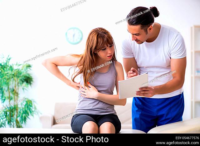 The young woman visiting male doctor physiotherapist