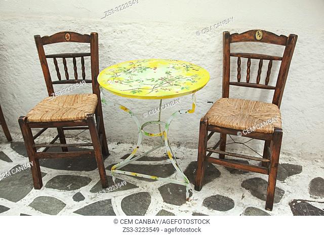 Traditional chairs and table in the alleys of the old town Chora, Naxos Island, Cyclades Islands, Greek Islands, Greece, Europe