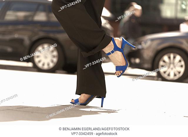 woman wearing stilettos at street