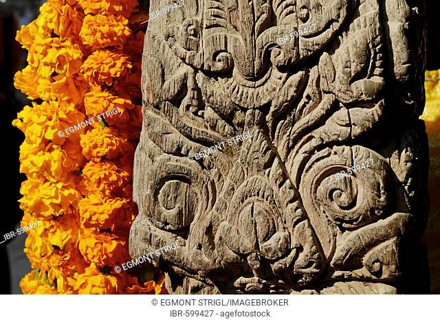Carved wooden coloumn with flower decoration, Patan, Kathmandu, Nepal