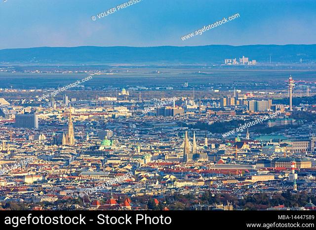Vienna, Vienna city center with cathedral Stephansdom (St. Stephen's Cathedral), church Votivkirche, radio tower Wien-Arsenal and mountain Leithagebirge in...