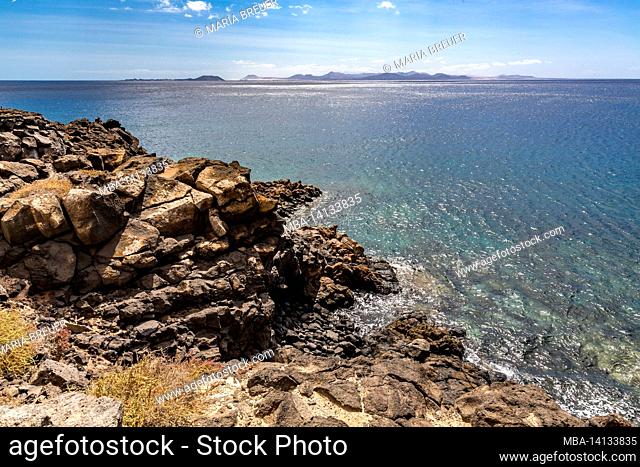 view of the islands of isla de los lobos and fuerteventura, playa blanca, lanzarote, canaries, canary islands, spain, europe